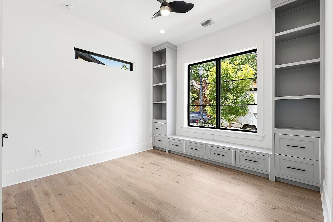 Bedroom with custom built-ins and window seat