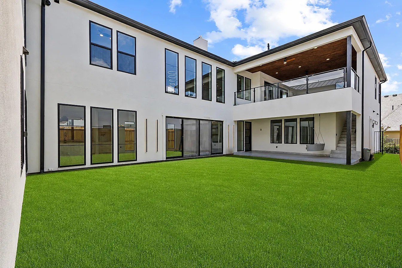 Custom home rear elevation and covered terrace